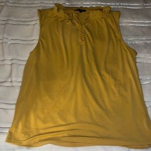Yellow sleeveless blouse with ruffled collar